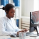 woman looking at computer