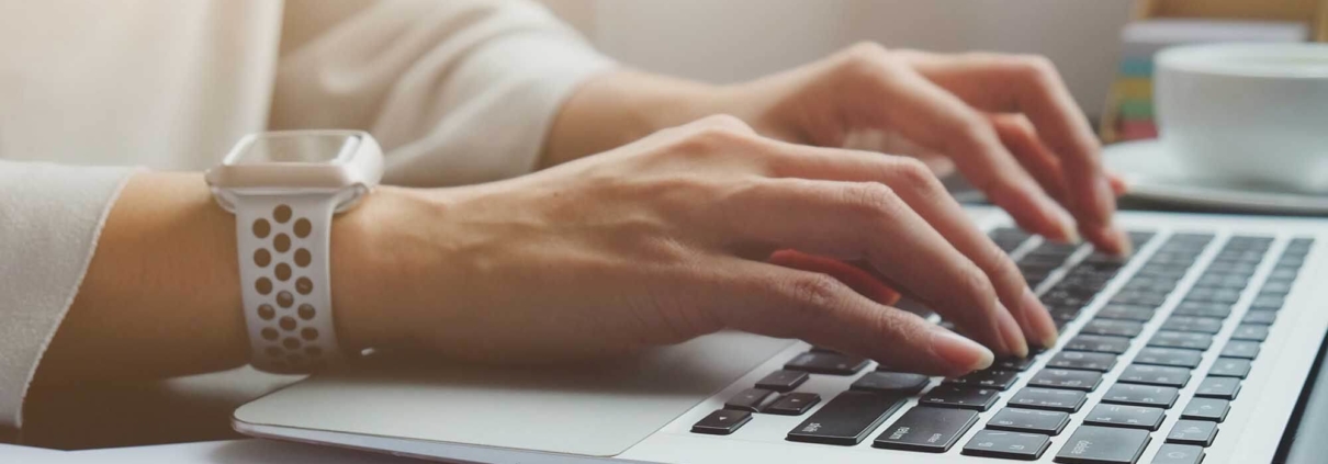 person typing on keyboard