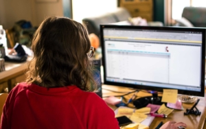 Woman looking at computer monitor