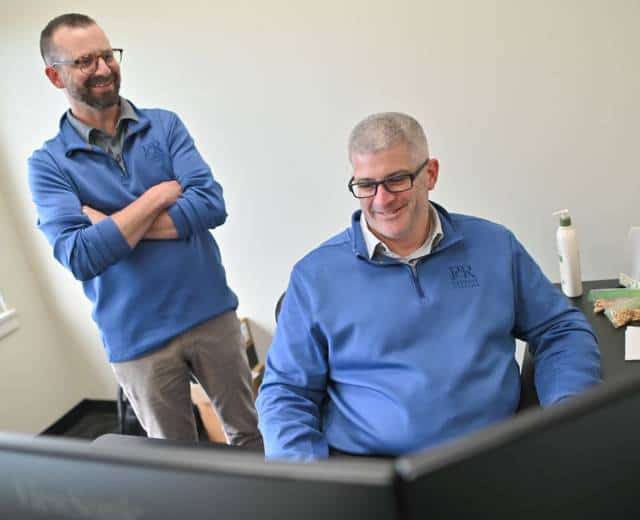 PCR Business Systems AI advisor working with small business owner in Akron Ohio